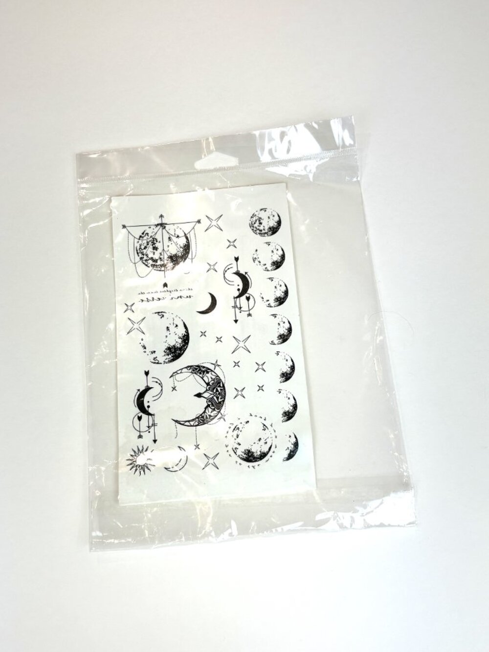 Temporary Tattoo Sheet of tiny Moon and Stars Designs tattoos. New